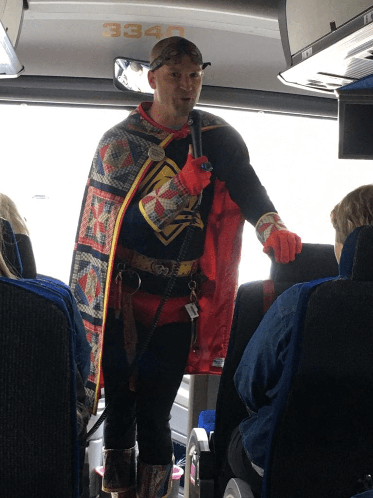 A man in costume on the bus